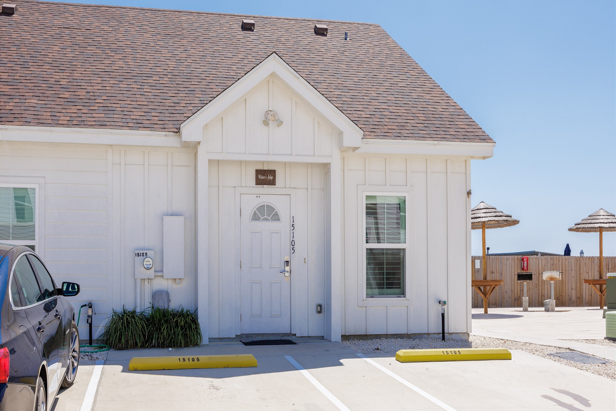 Inviting front view of the property featuring reserved parking conveniently located for easy access