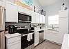 Stainless steel appliances and coffee maker in the fully equipped kitchen