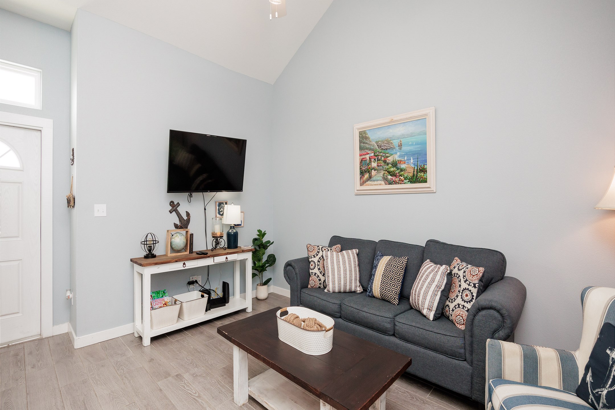 Comfortable living area with queen sleeper sofa and flat screen TV