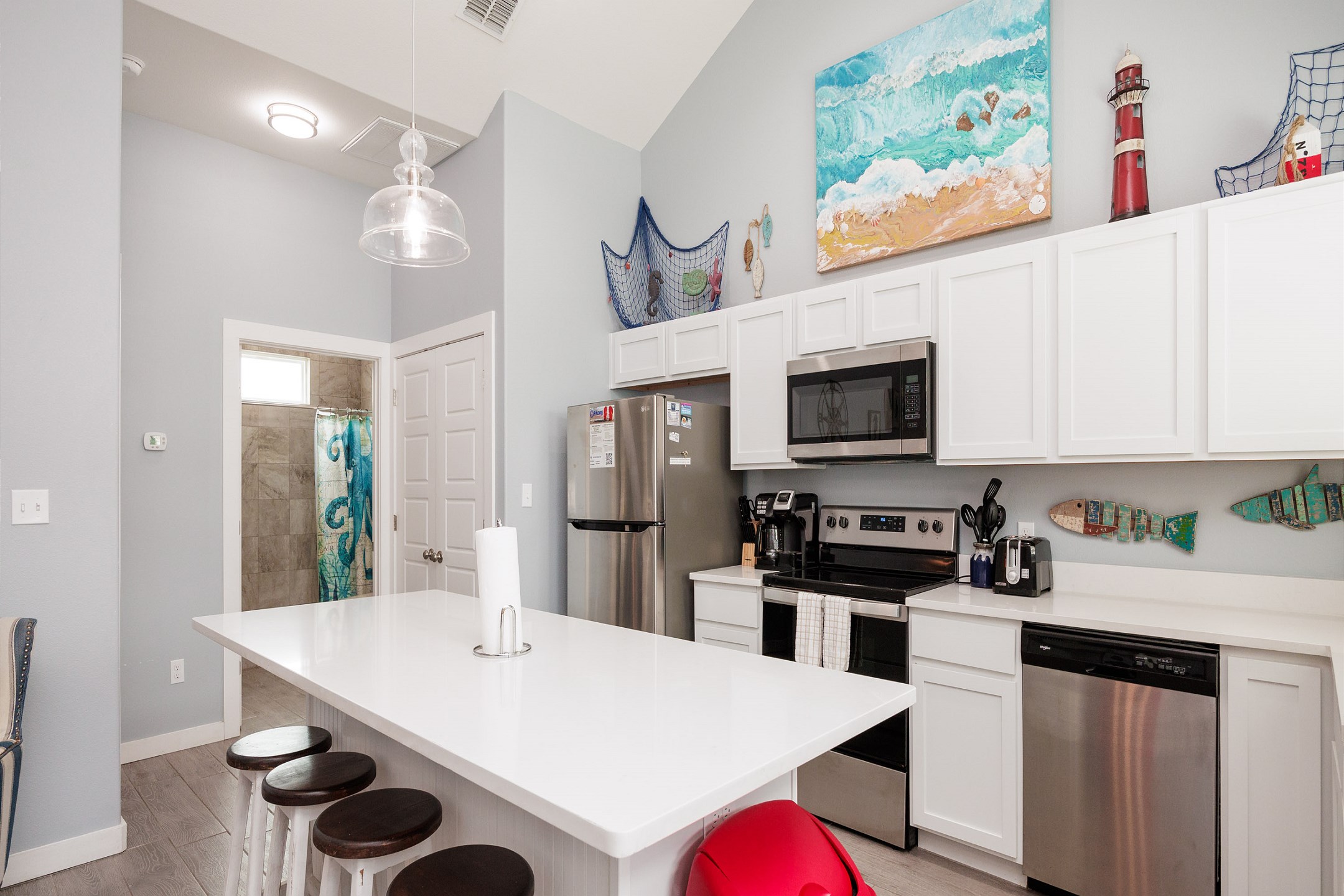 Well stocked kitchen with breakfast bar