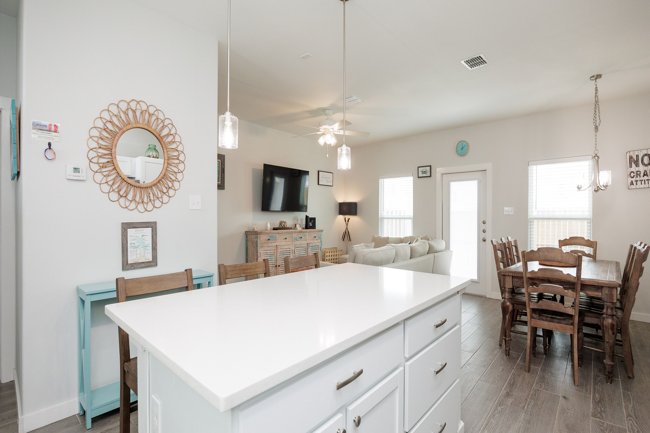 Open concept kitchen, dining, and living area for family gatherings during dinner or game night