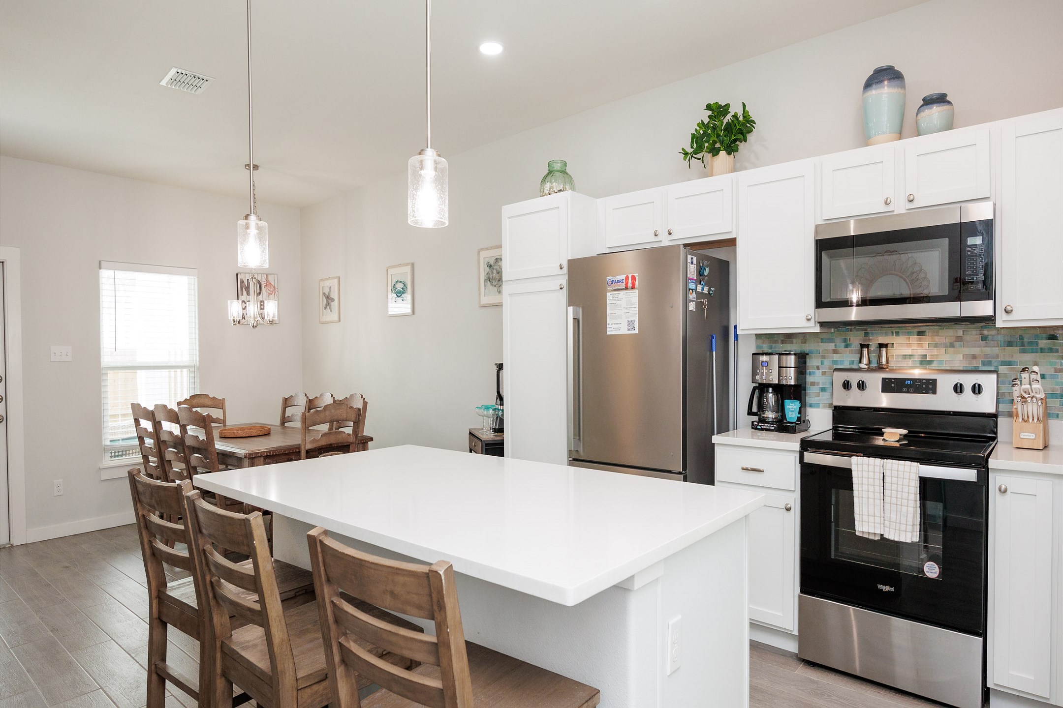 Kitchen area with island, bar stools, and everything you need to cook