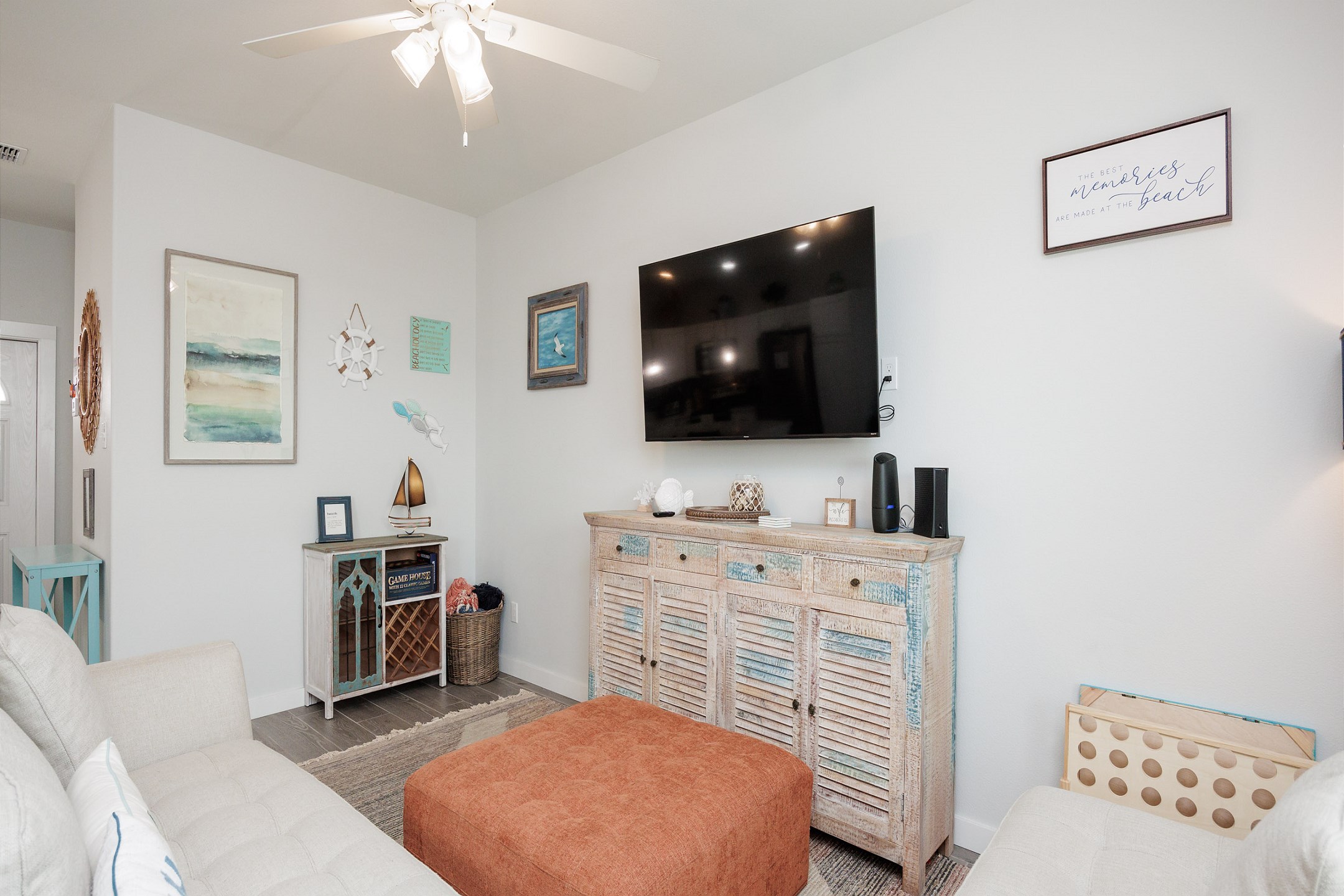 Comfy living area with entertainment center and flat-screen TV 
