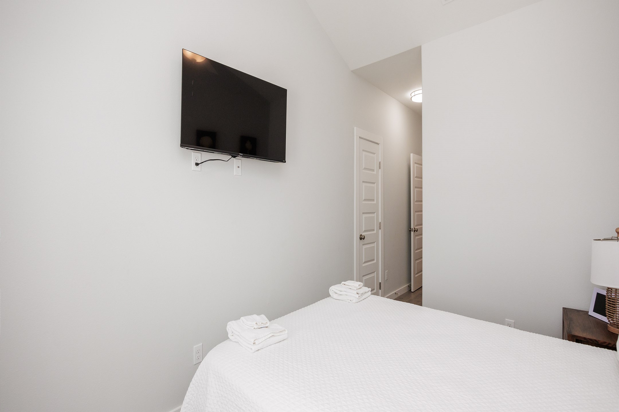 Second bedroom on the second floor with queen size bed, private balcony and flat screen TV