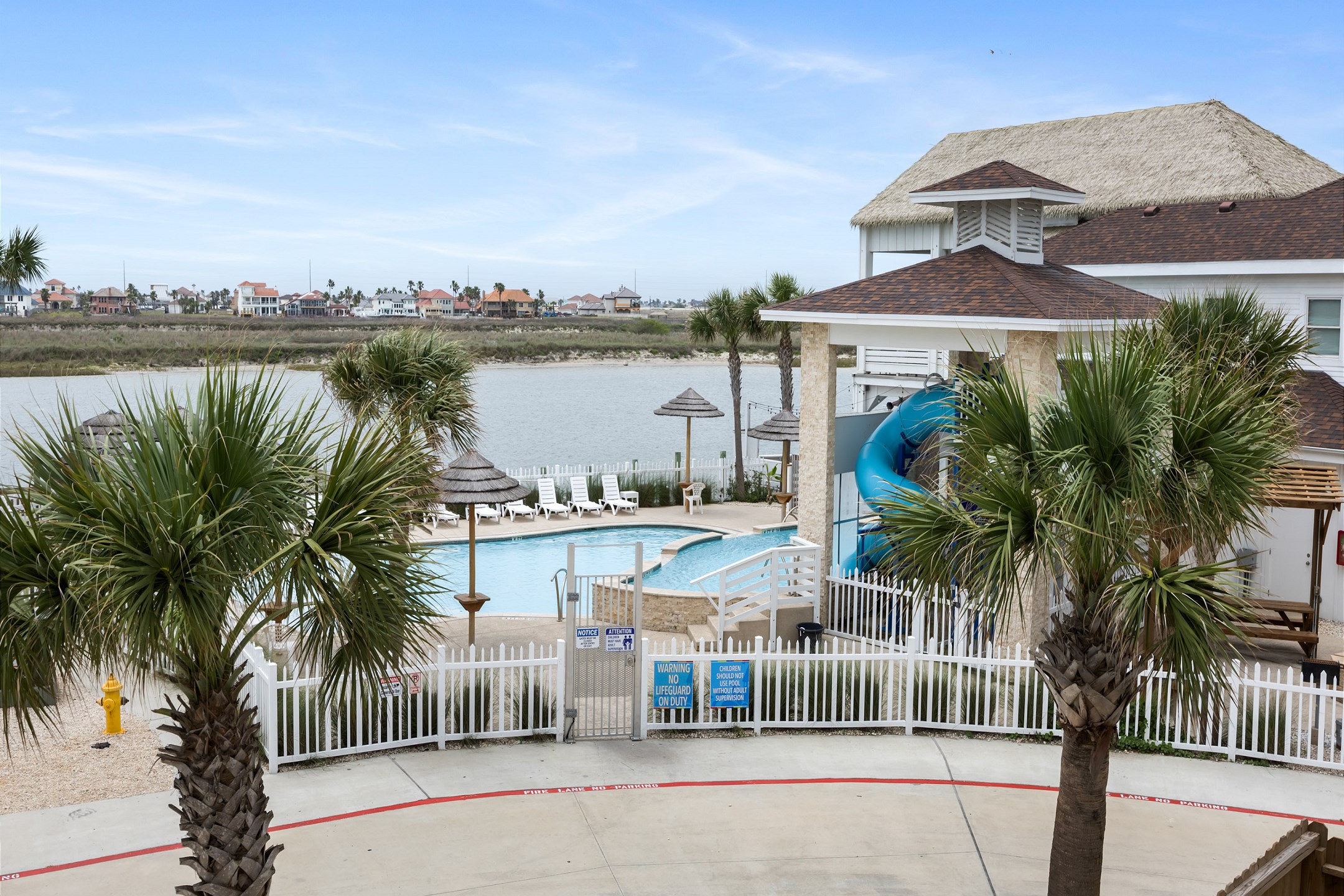 Second floor balcony view of the pool and canal