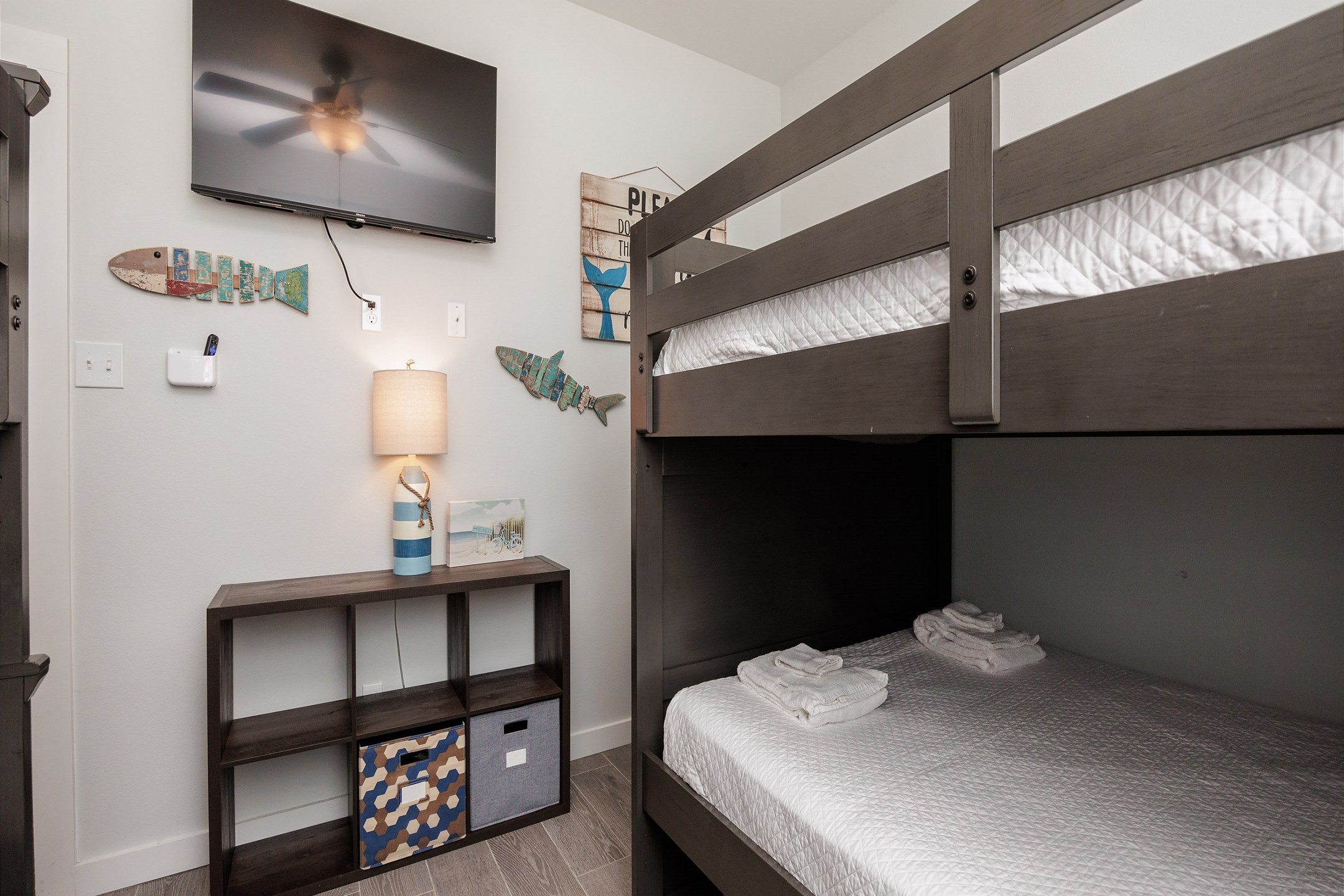 Third bedroom on the second floor with two sets of full over full size bunk beds and a flat screen TV