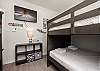 Perfect for families or groups, the third bedroom offers two sets of full-over-full bunk beds and a flat-screen TV.