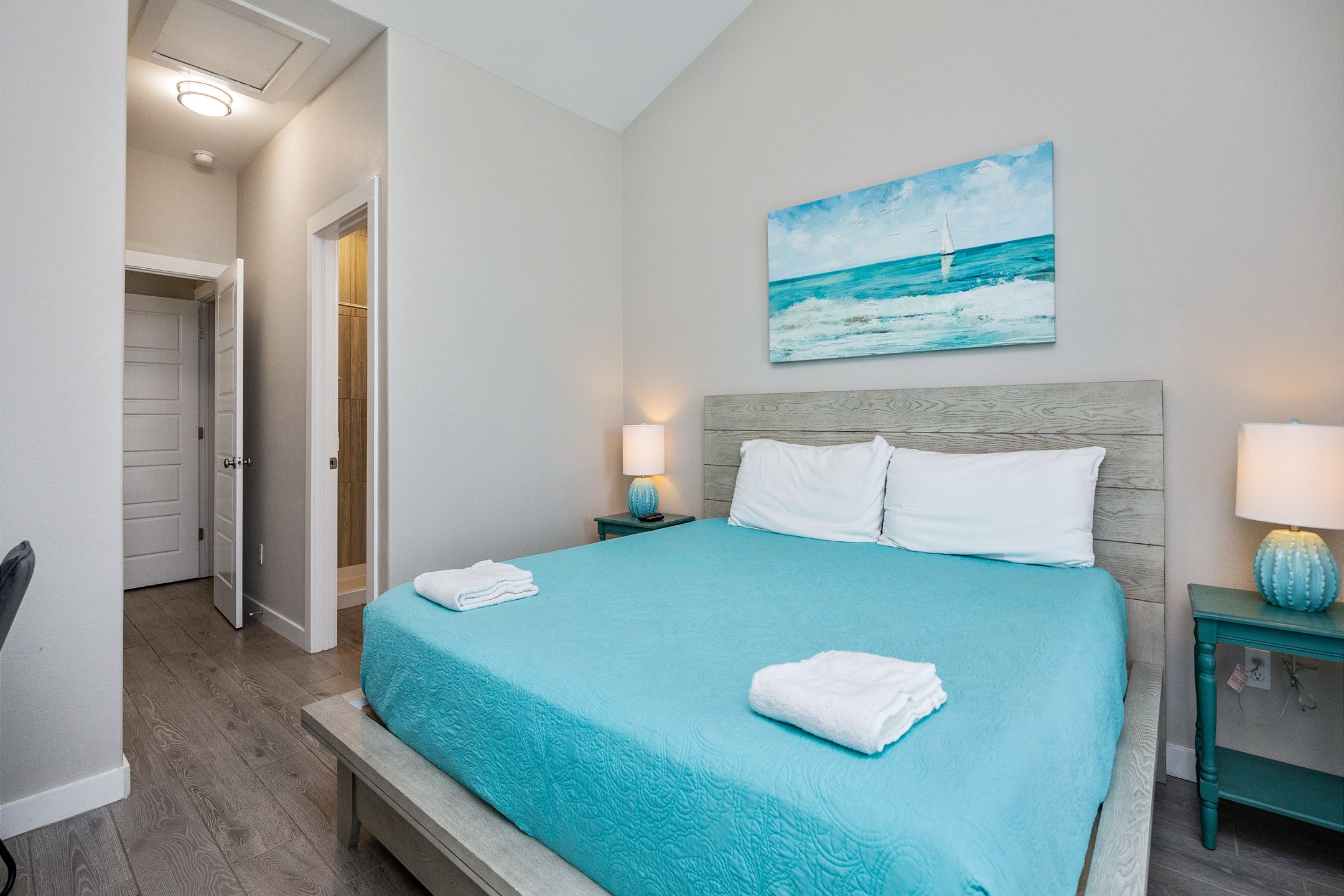 Master bedroom on the second floor with king size bed, private bathroom, private balcony and flat screen TV