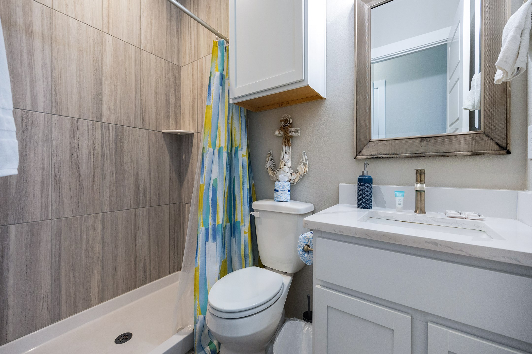 Master bathroom on the second floor with sink, toilet, and walk-in shower 