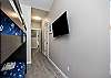 Second floor bedroom with full-over-full bunk beds and flat screen TV