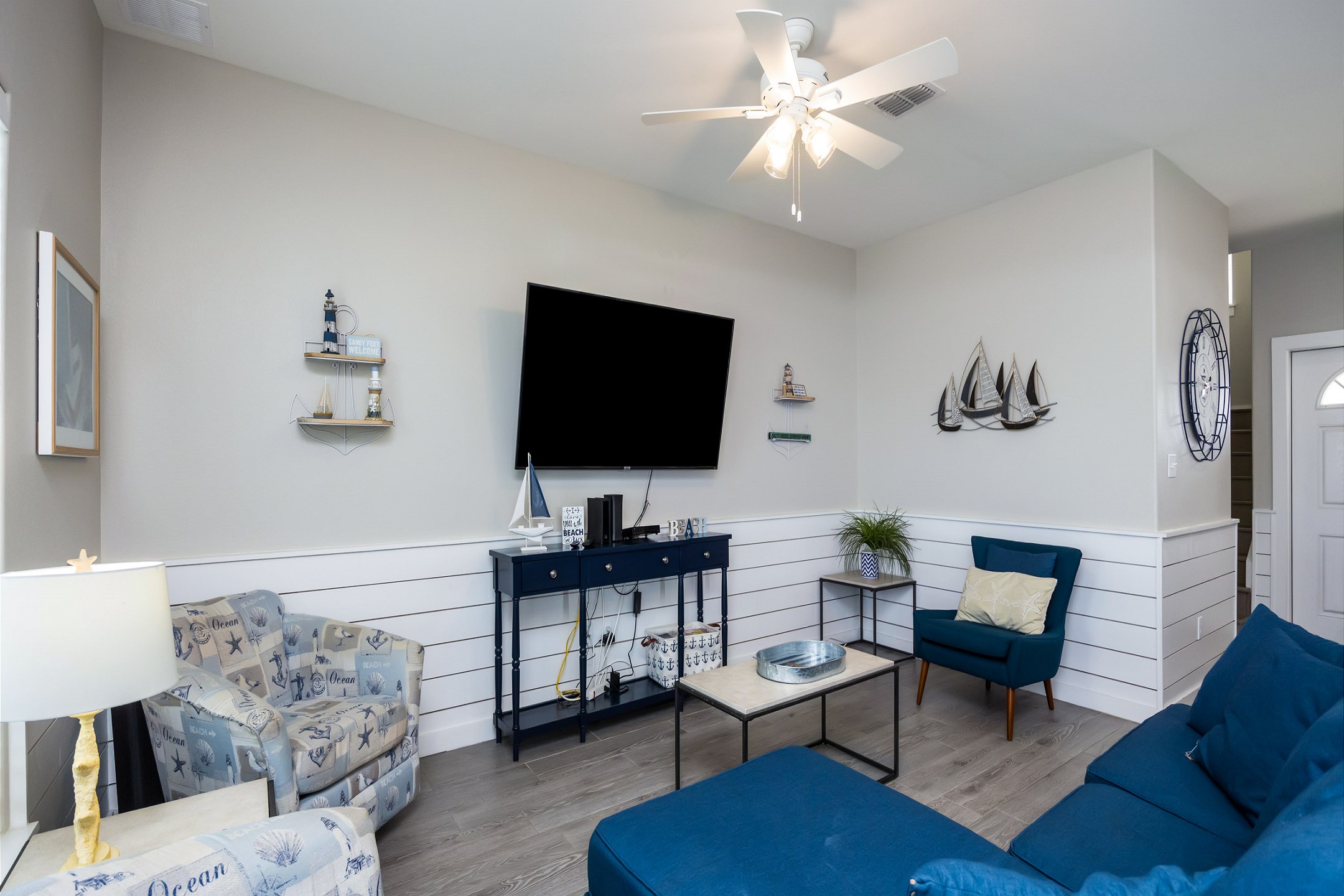 Living area with queen size sleeper sofa and flat screen TV 