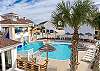 The sparkling Aruba Bay Resort pool overlooks the canal, offering a picturesque backdrop.