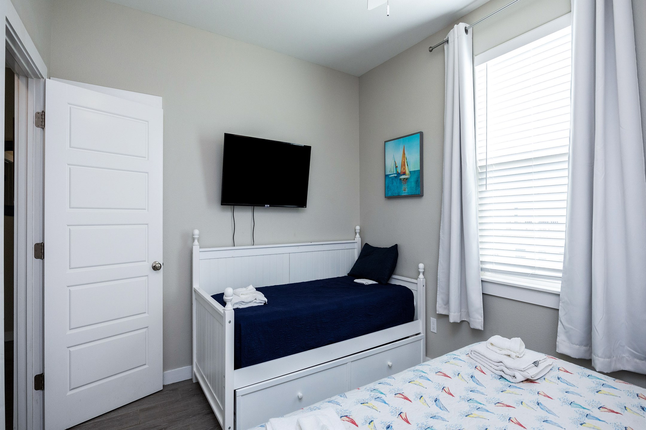 Second bedroom on the second floor with king size bed, twin daybed, with twin trundle, along with a flat screen TV 