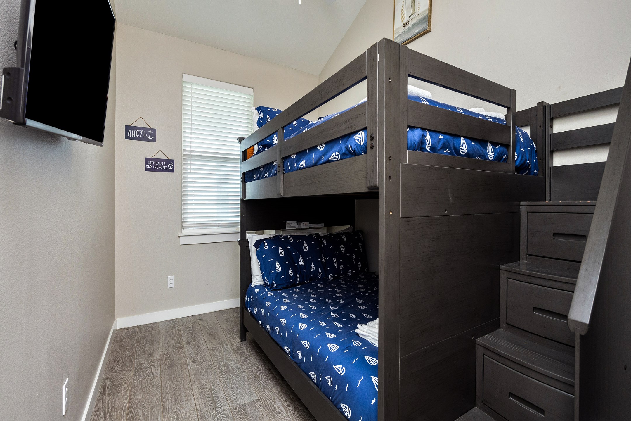Third bedroom on the second floor with full over full size bunk beds and flat screen TV 
