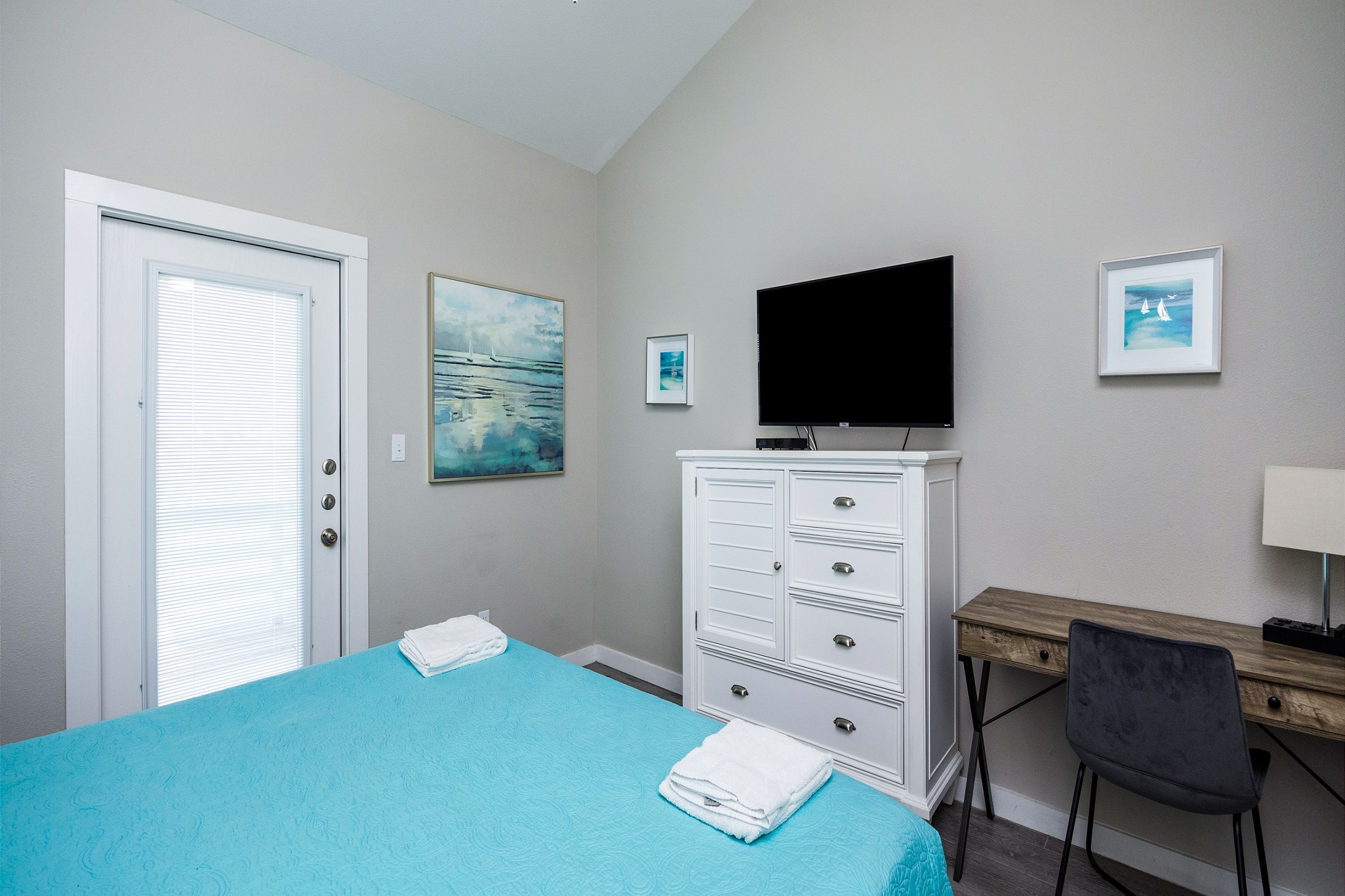 Master bedroom on the second floor with king size bed, private bathroom, private balcony and flat screen TV