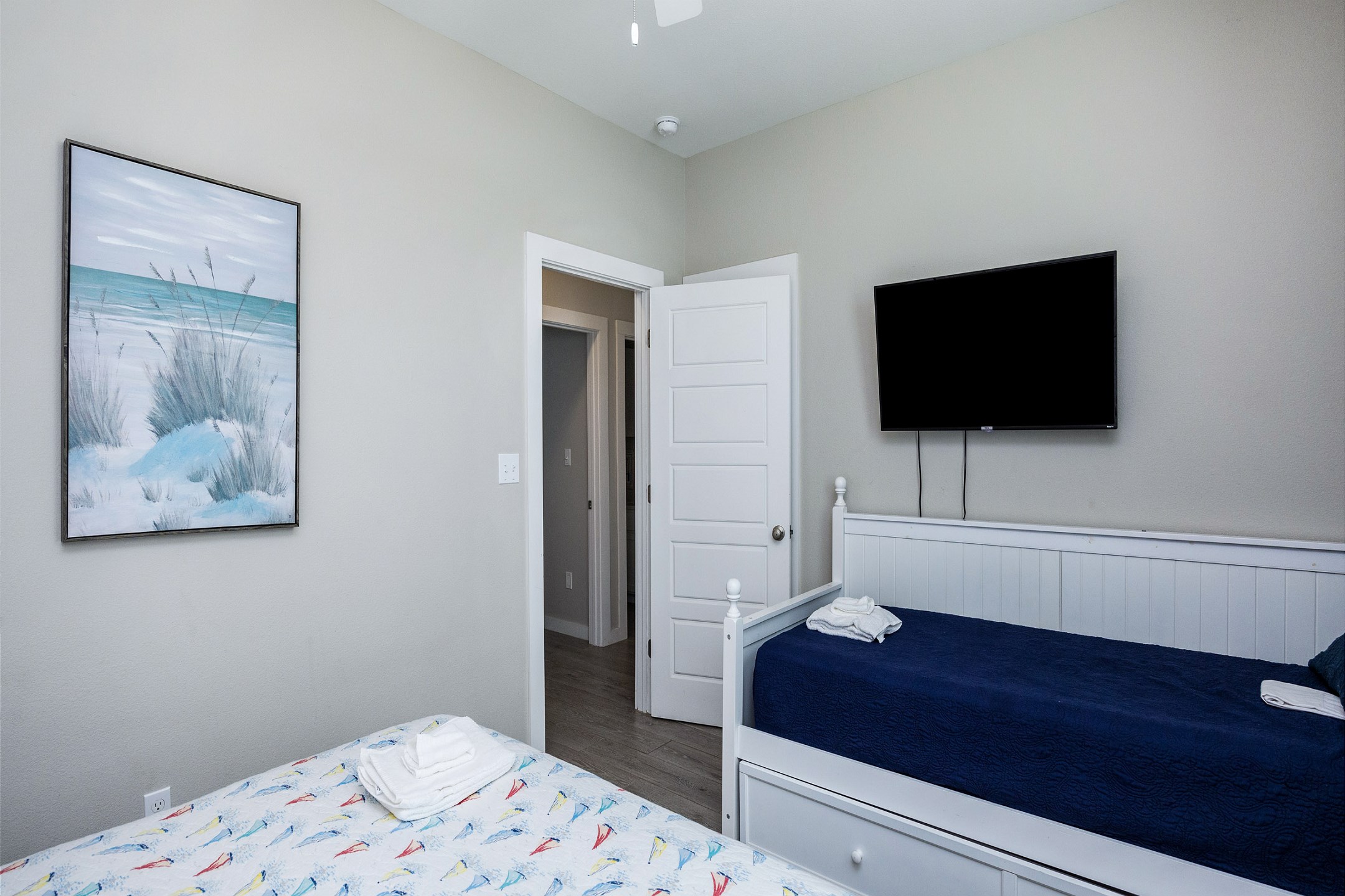 Second bedroom on the second floor with king size bed, twin daybed, with twin trundle, along with a flat screen TV 