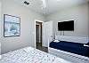 Second bedroom on the second floor with king size bed and twin daybed with twin trundle, along with a flat screen TV 