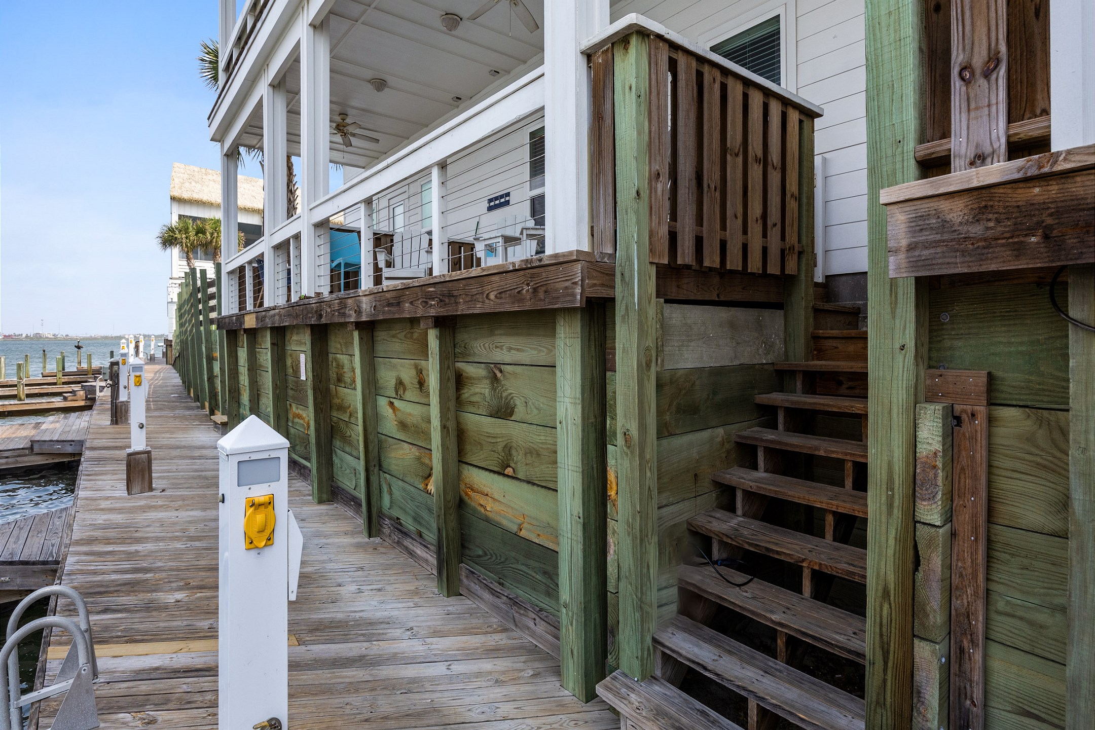 Stairs from your private patio to the boat slips and a short walk to the pool area