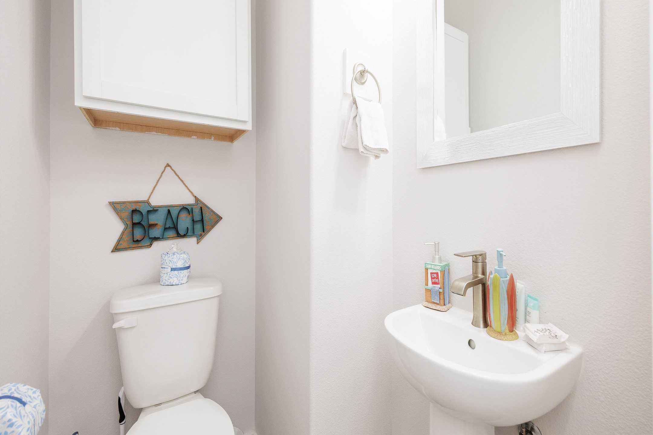 Half bathroom off the hallway with single sink 