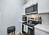 Modern kitchen with stainless steel appliances and 12 cup coffee maker 