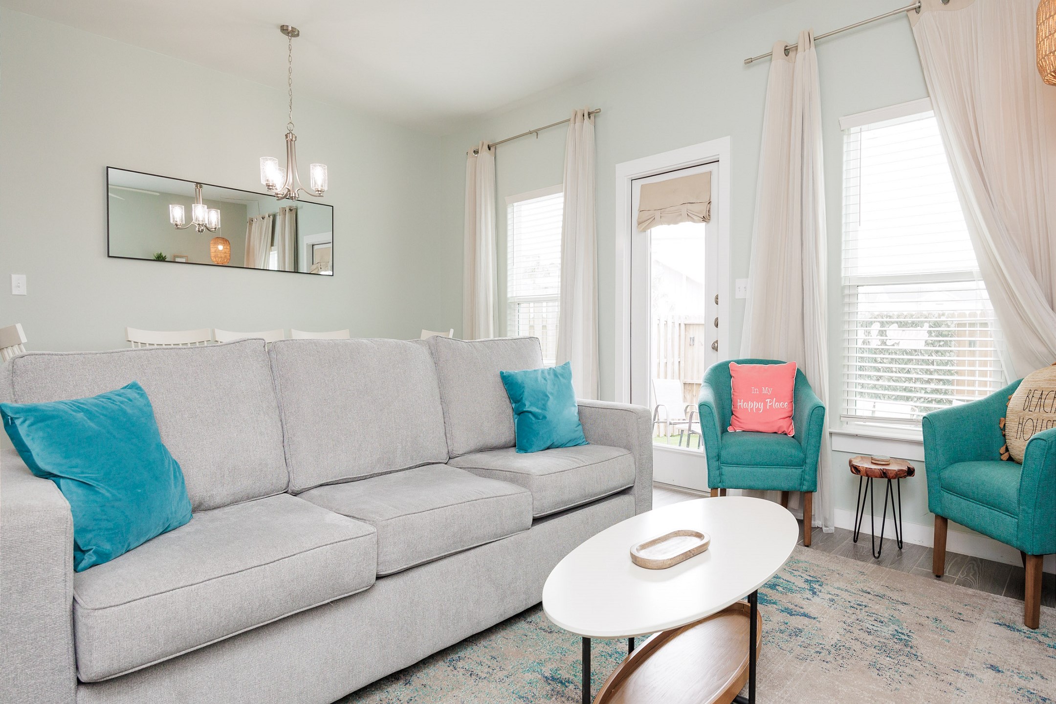 Inviting living space filled with natural light and generous seating for family comfort