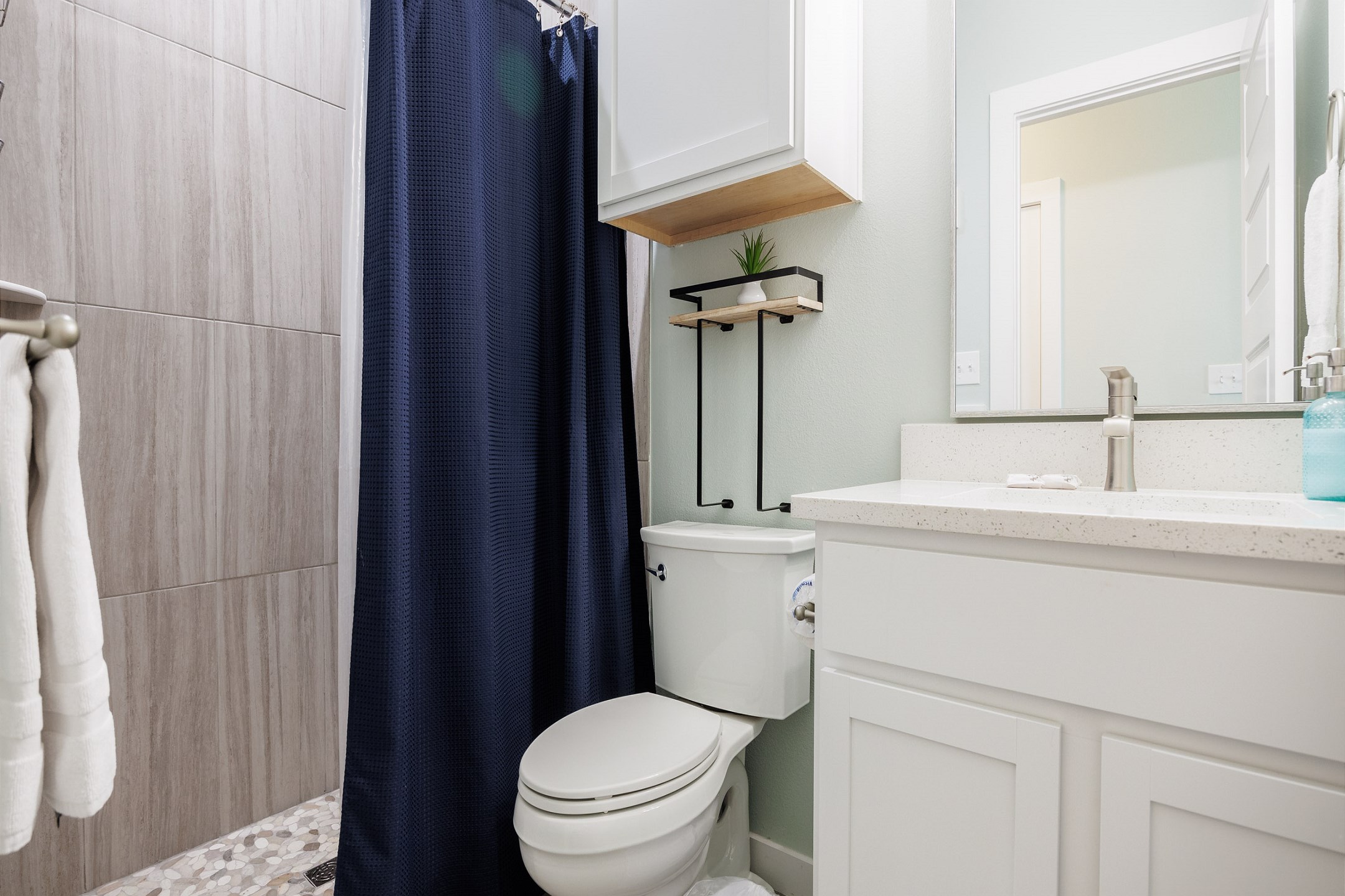 Master bathroom on the second floor with tiled walk-in shower 