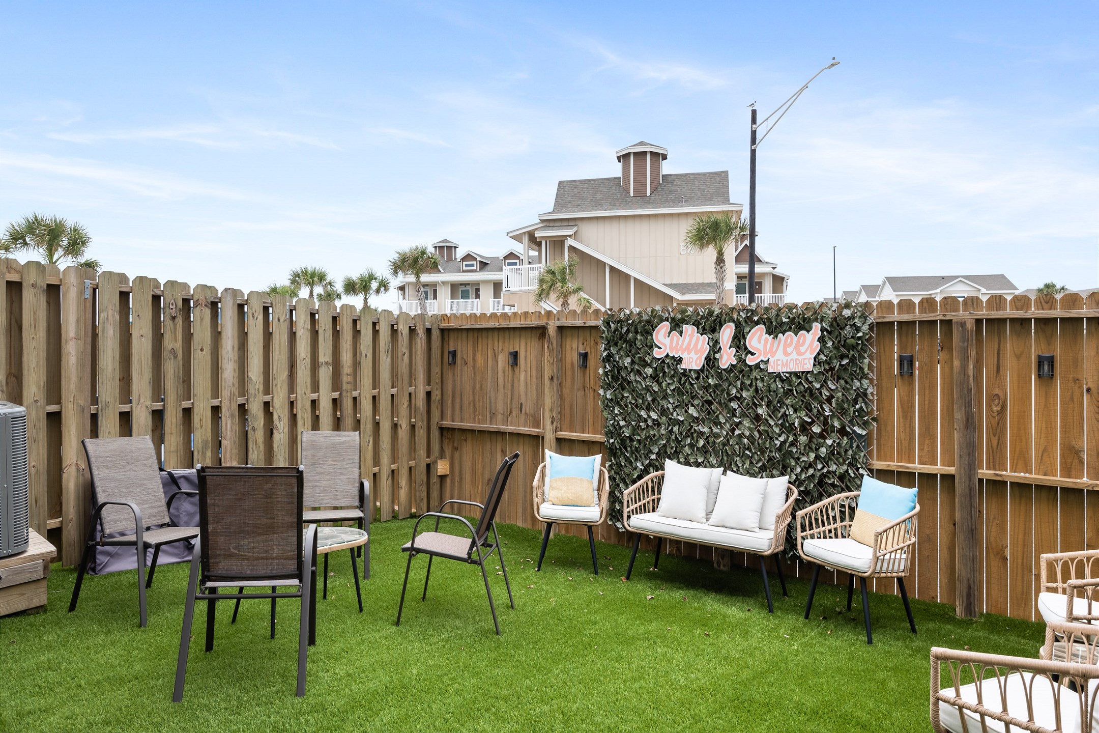 Charming back patio with turf grass, perfect for relaxing and entertaining