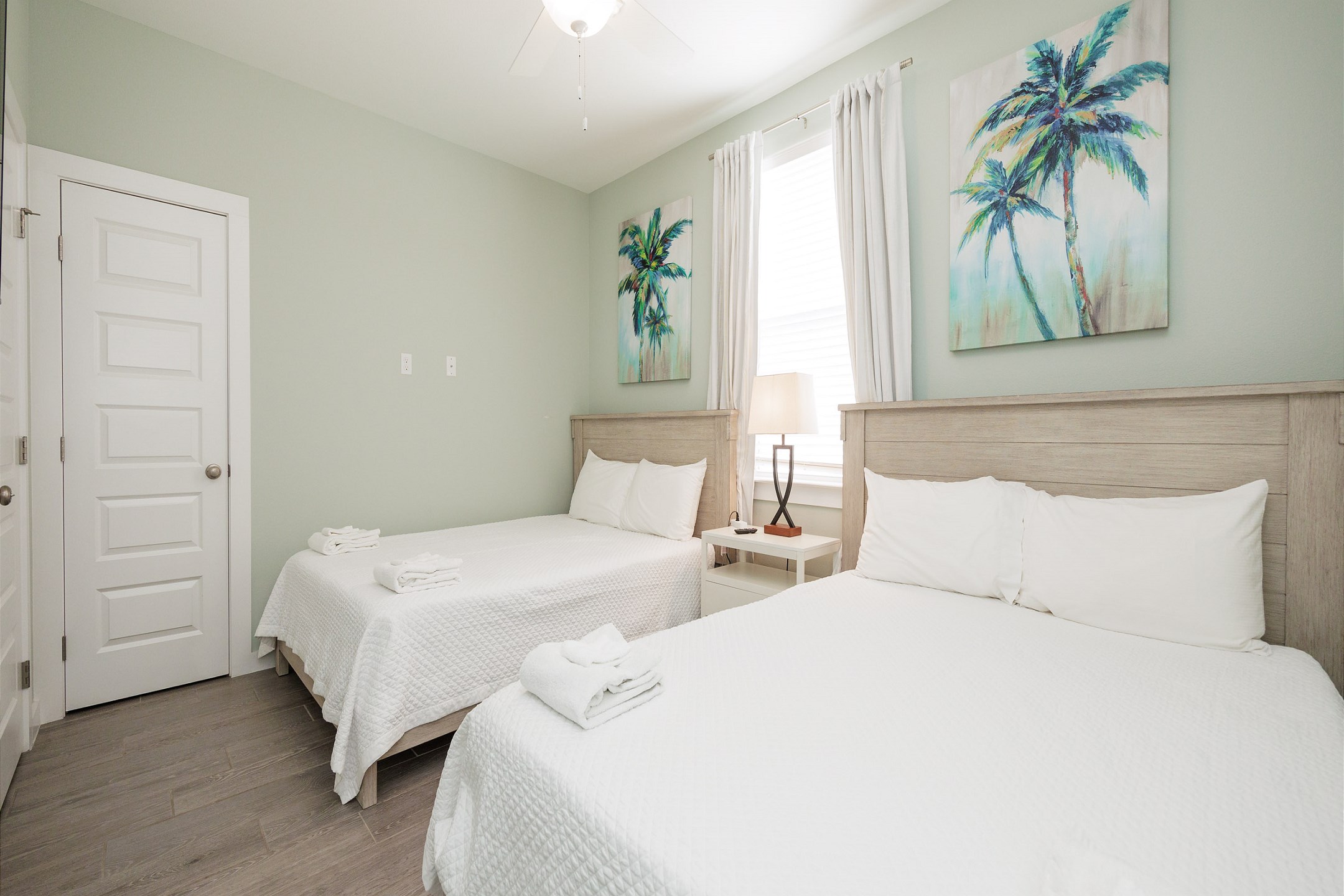 Third bedroom on the second floor with two queen size beds and a flat screen TV