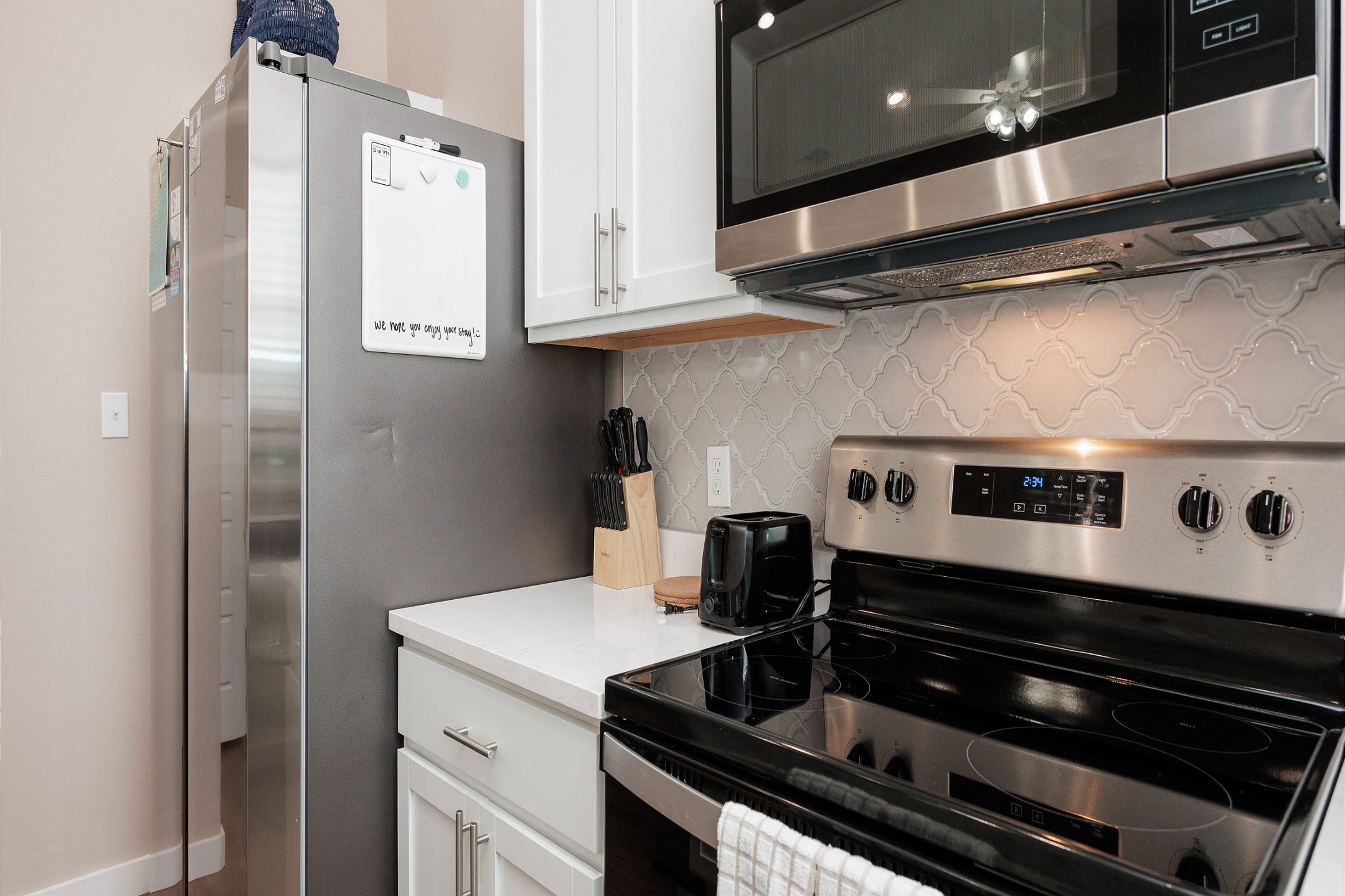 Kitchen space with stainless steel appliances and coffee maker