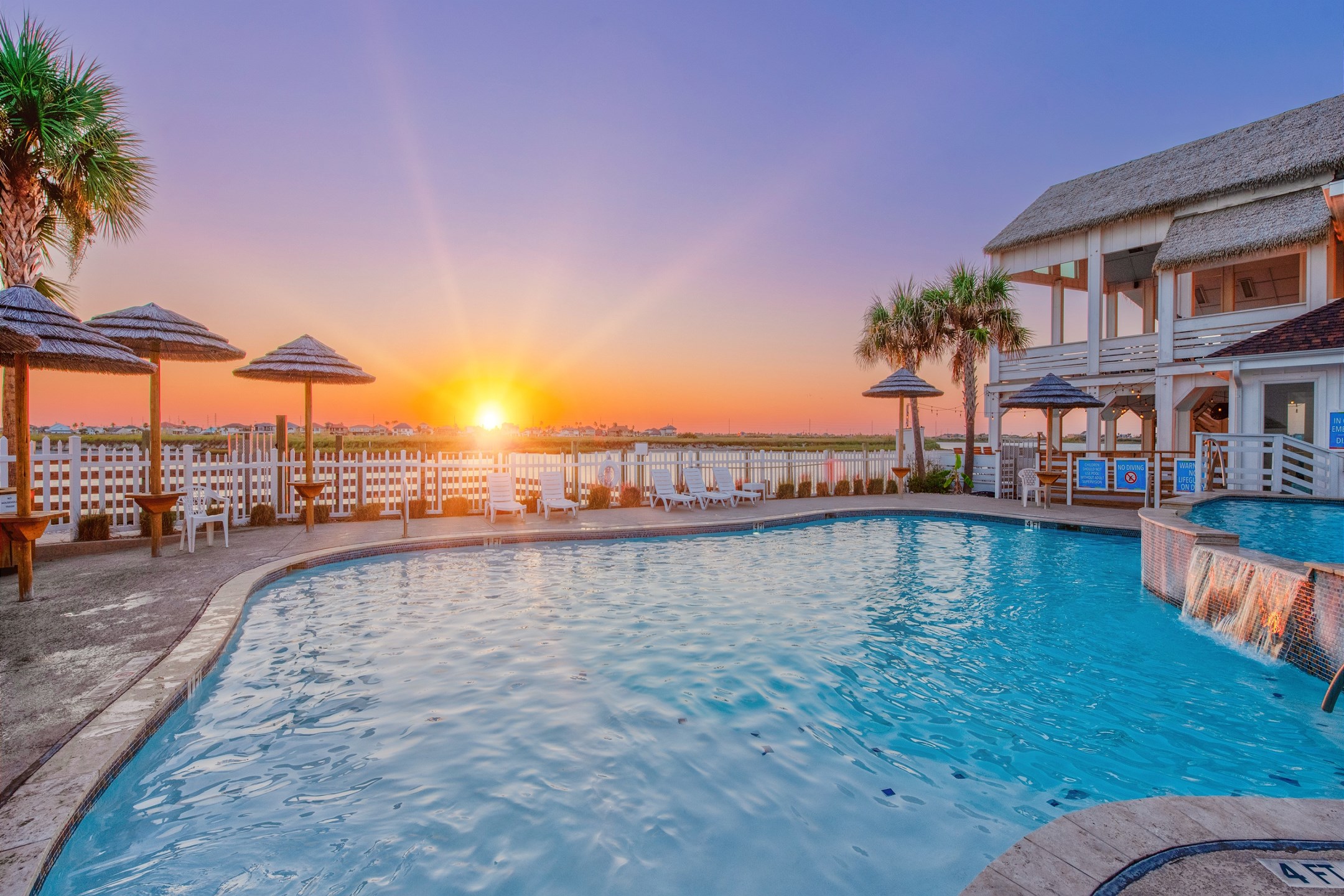 Soak up amazing water views from the poolside lounge seating