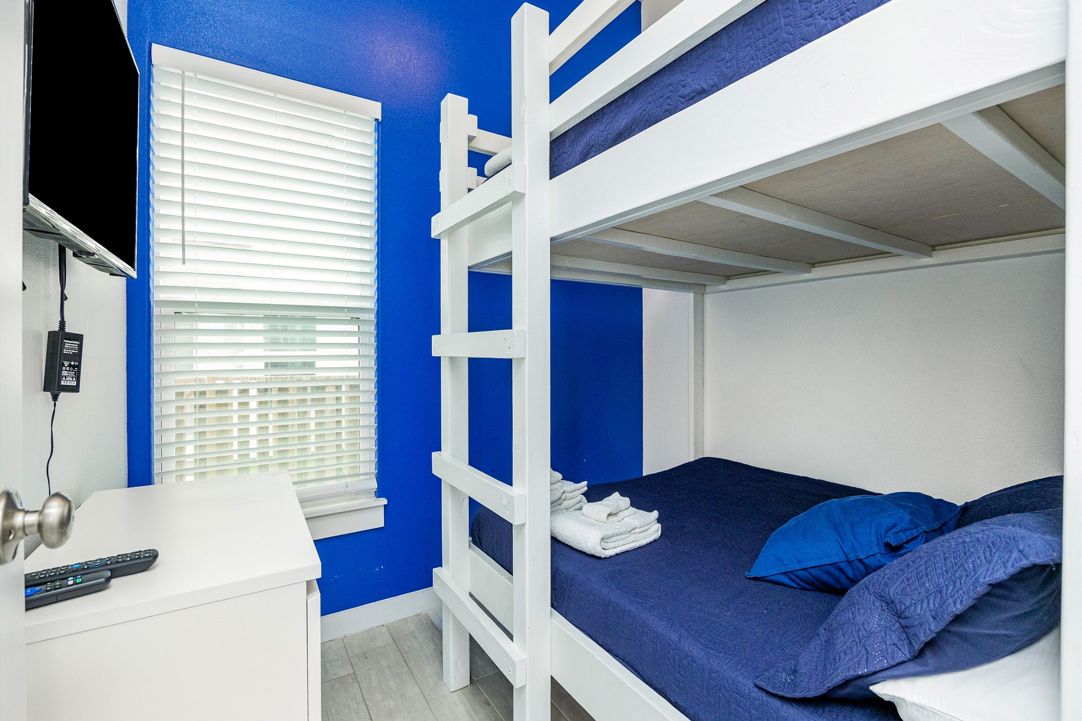 Second bedroom with full over full size bunk bed and flat screen TV