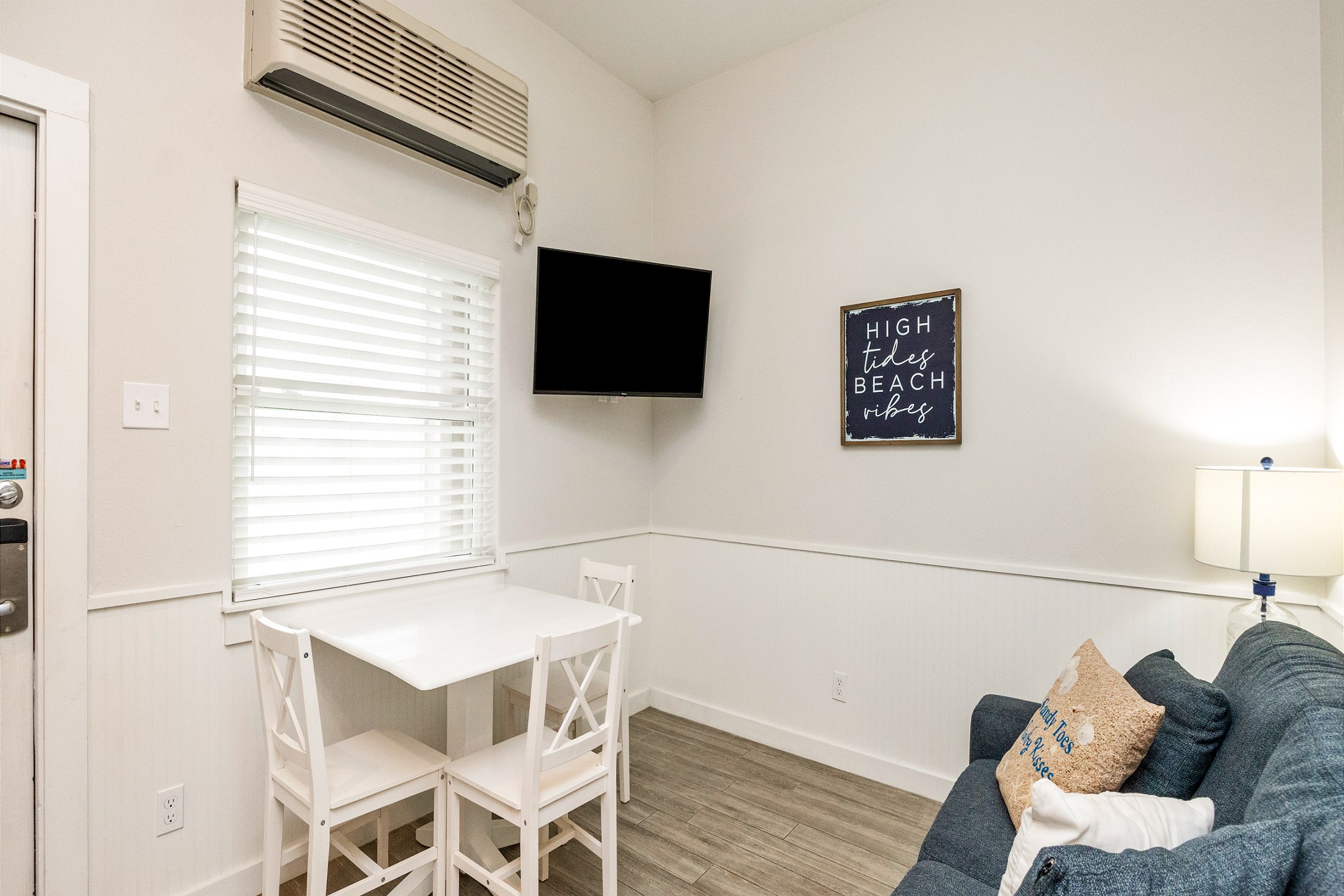 Cozy living area with dining table and flat screen TV 