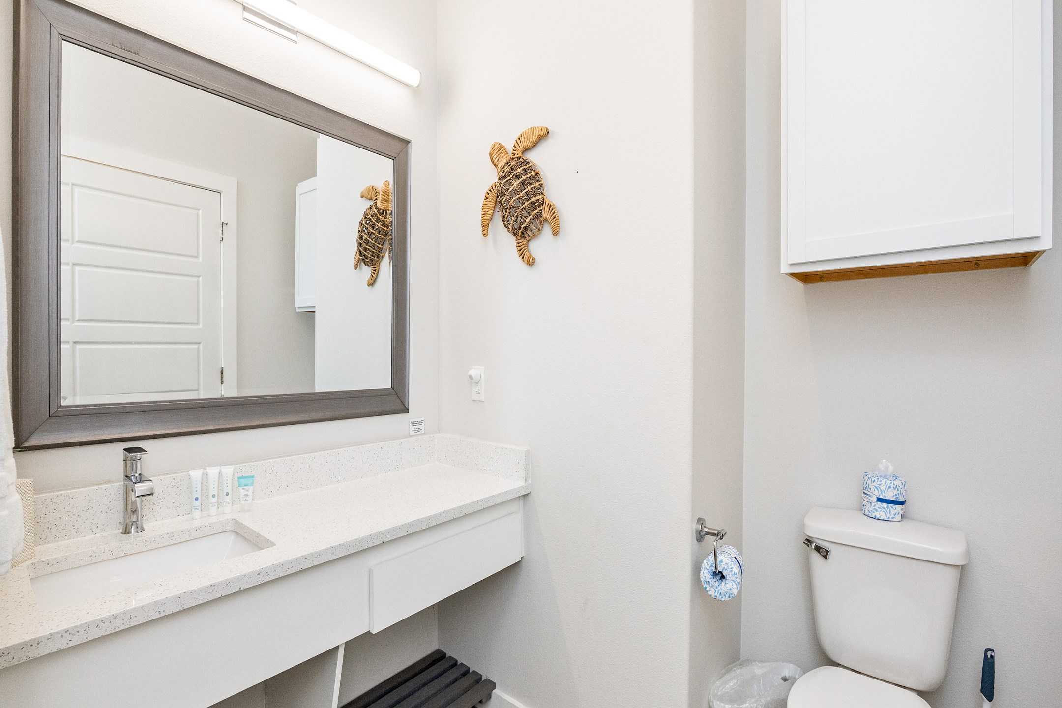 Full bathroom with single sink, toilet, and walk-in shower