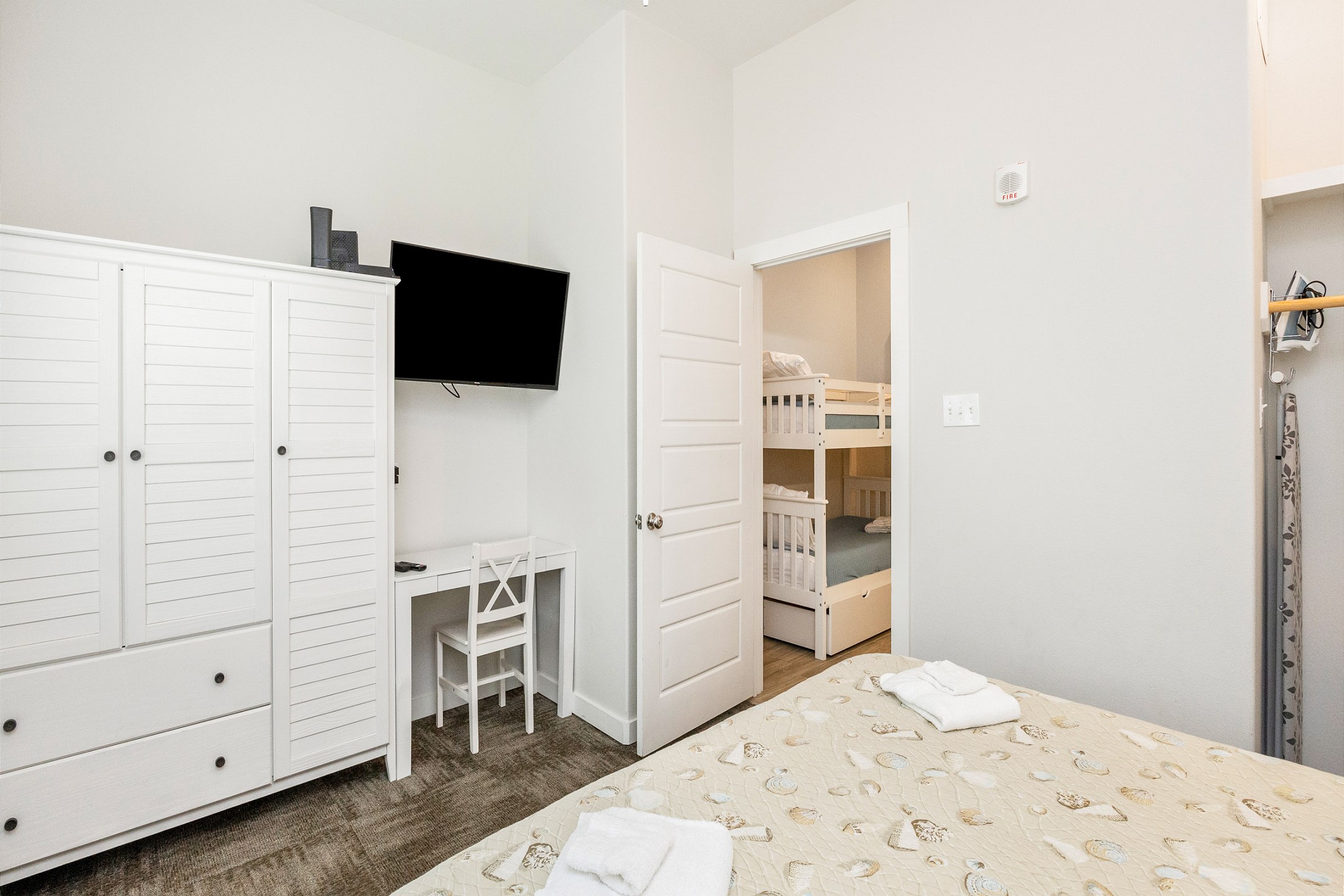 Master bedroom with king size bed and flat screen TV