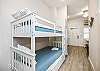 Twin bunk beds in the hallway nook