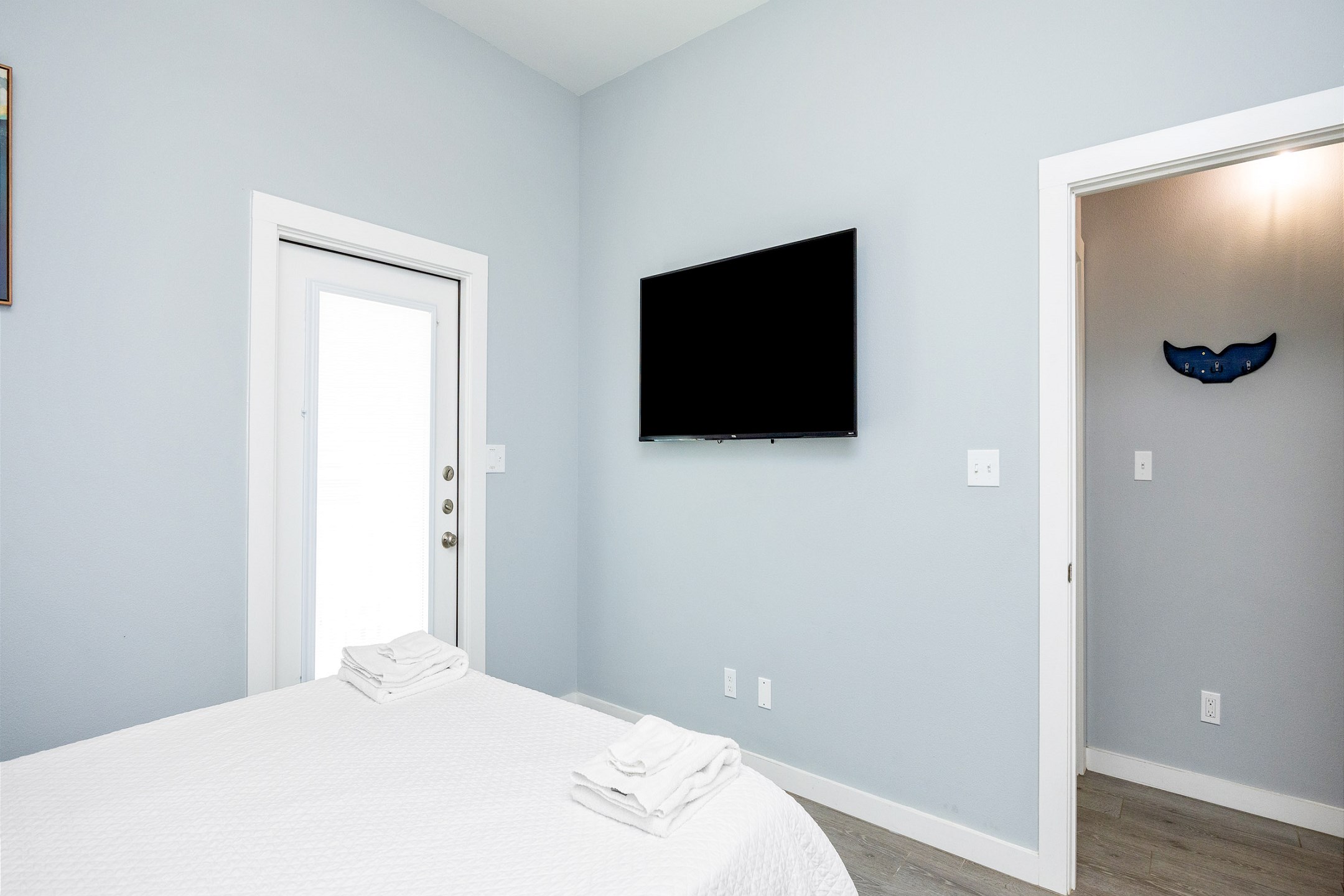 Master bedroom with queen size bed, access to private patio and 65in flat screen TV 