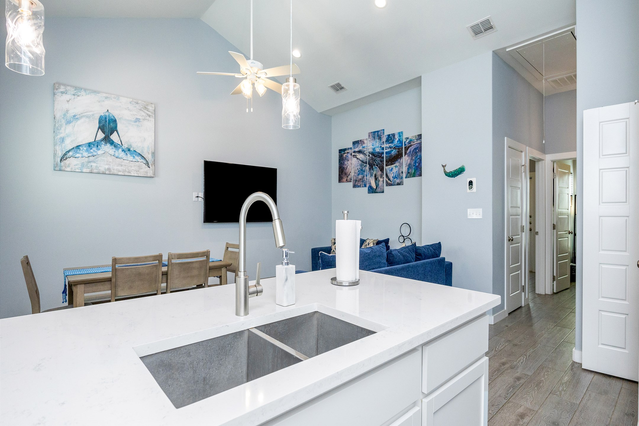 Kitchen area with open view of the dining and living area 