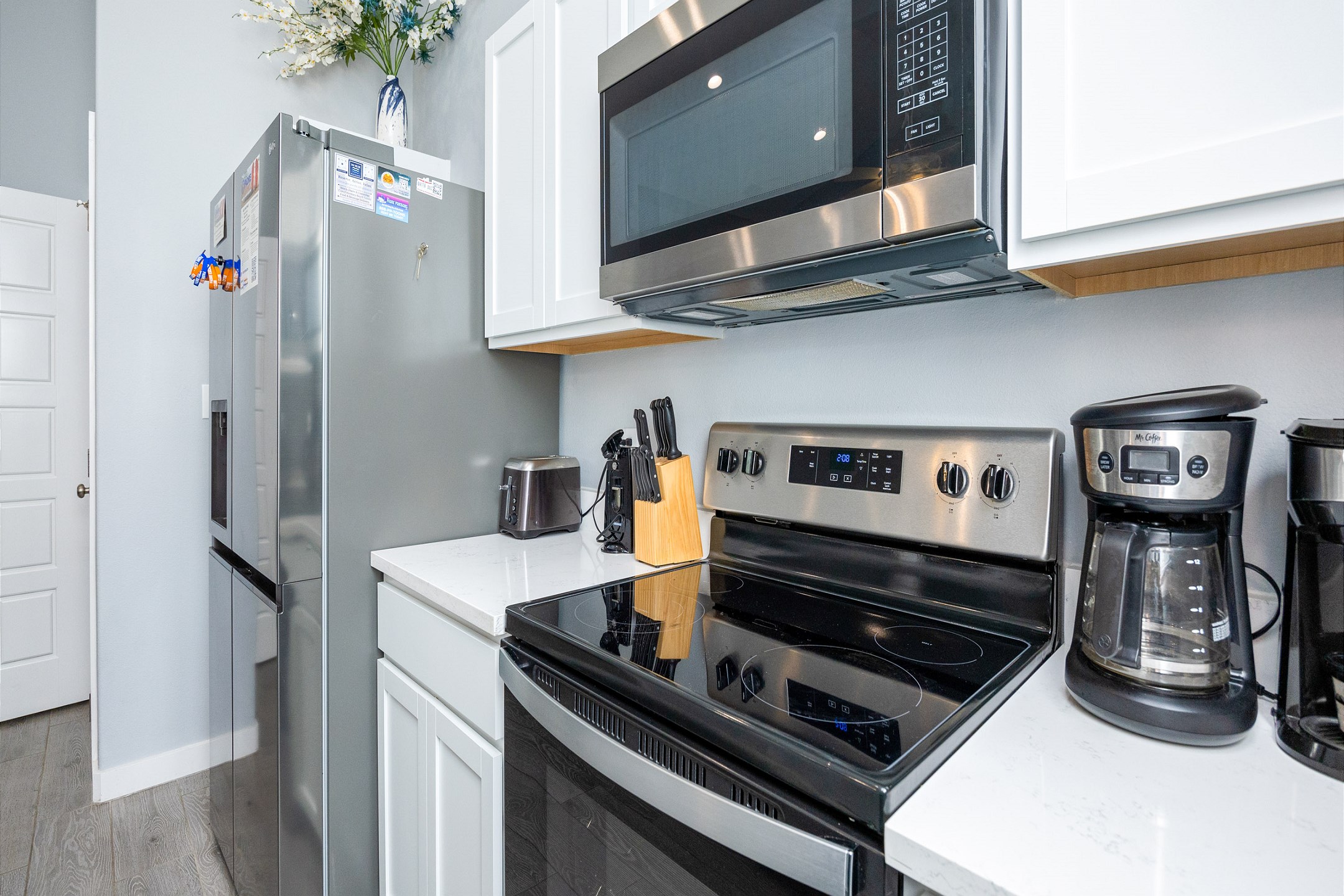 Fully equipped kitchen area with coffee maker 