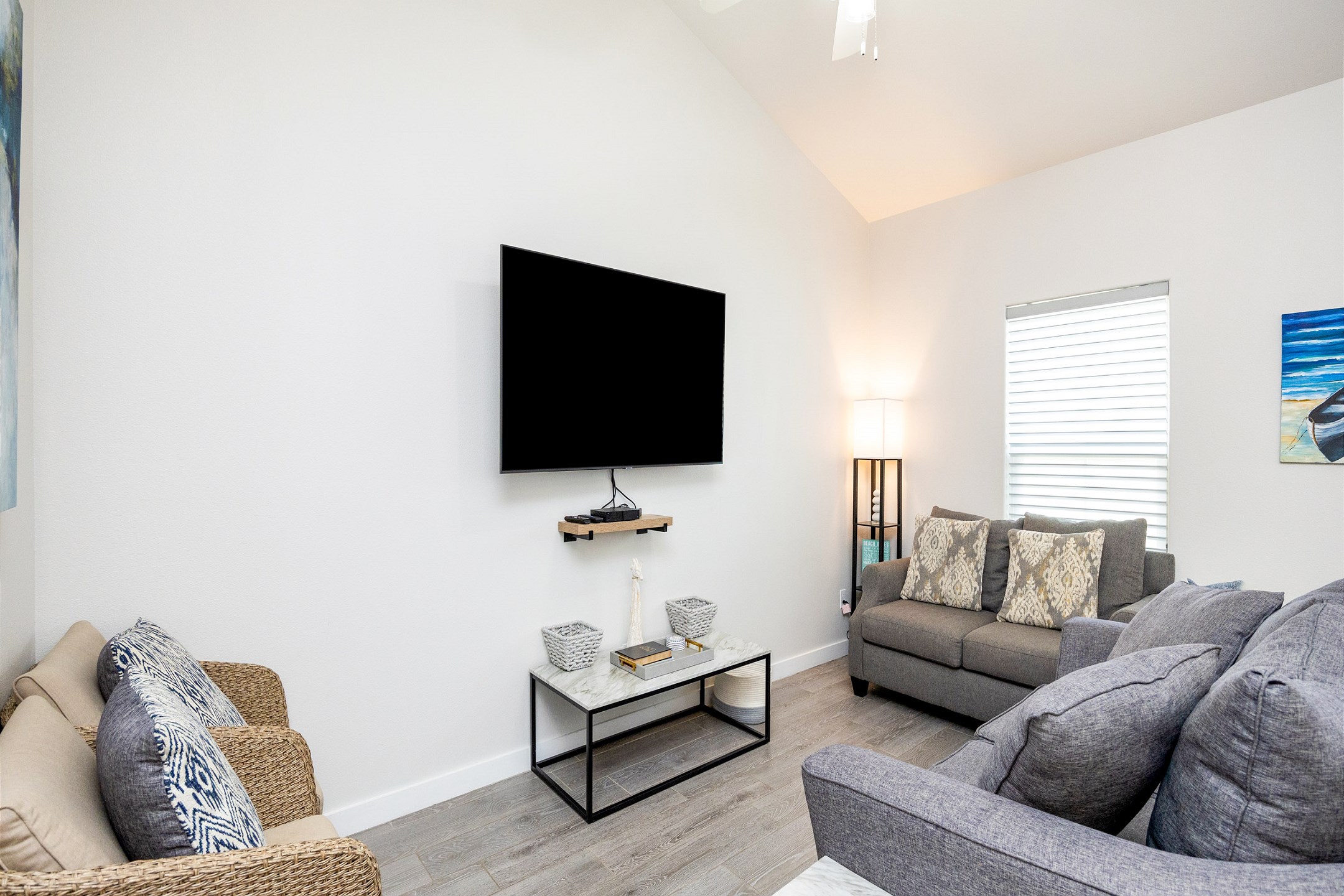 Relax in the modern living room equipped with a sleek flat-screen TV