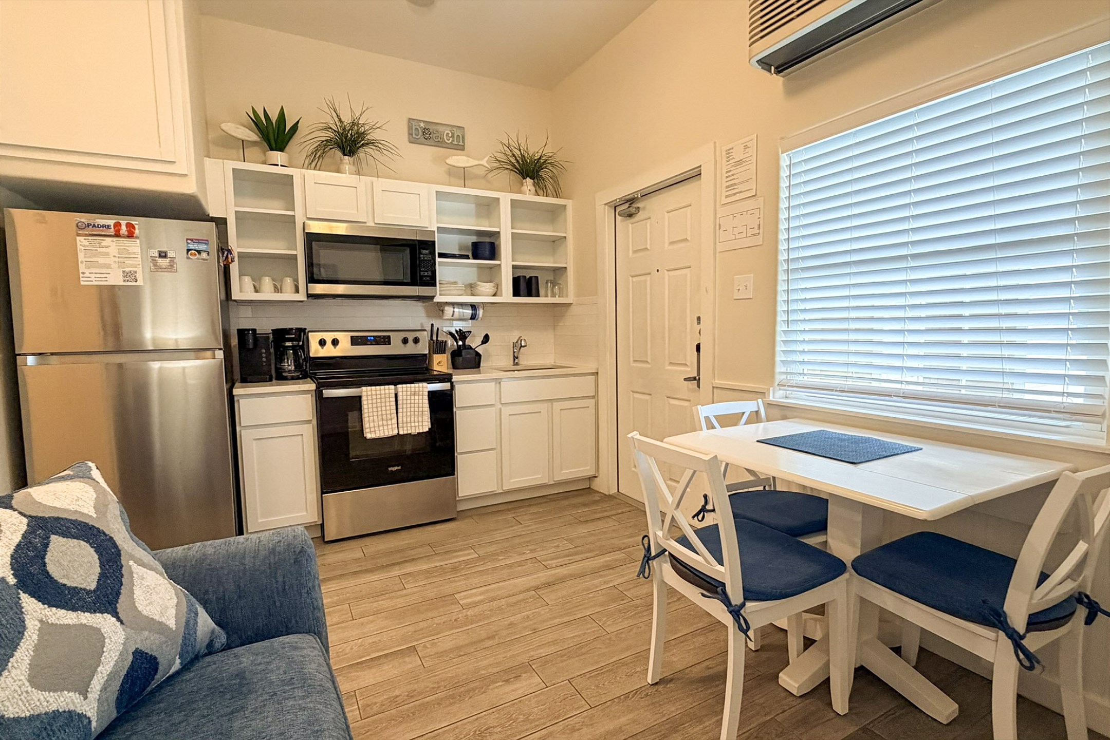 Kitchen and dining area with seating for four 