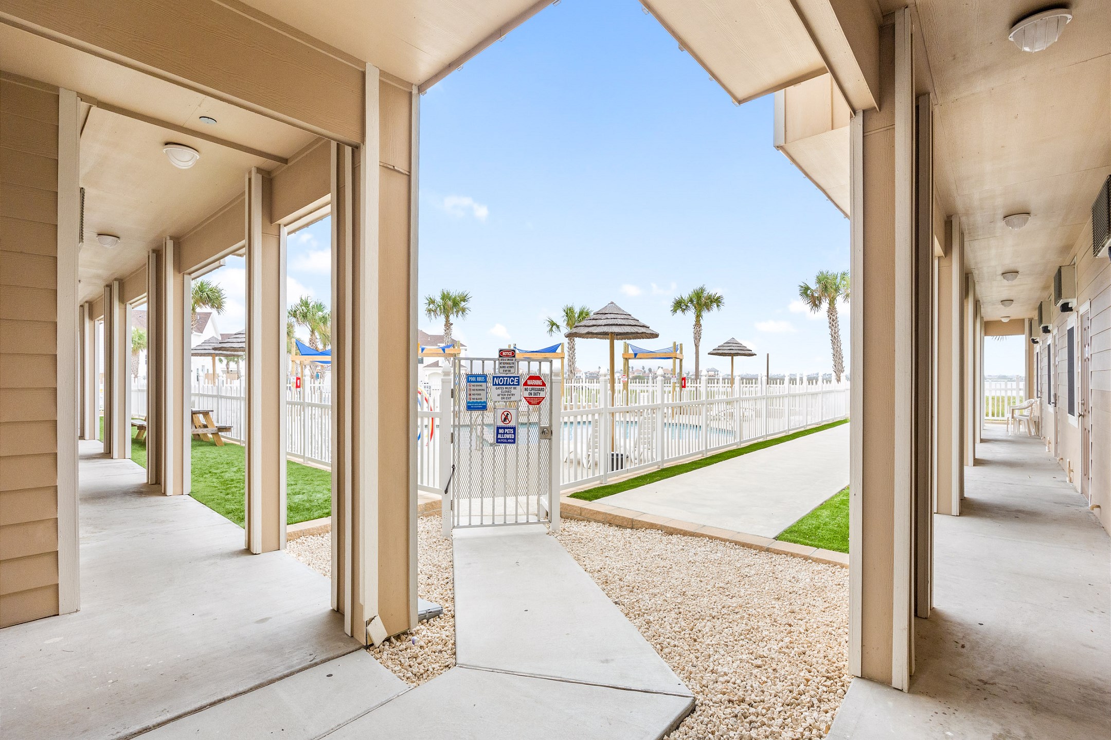 Front entrance to property with pool view 