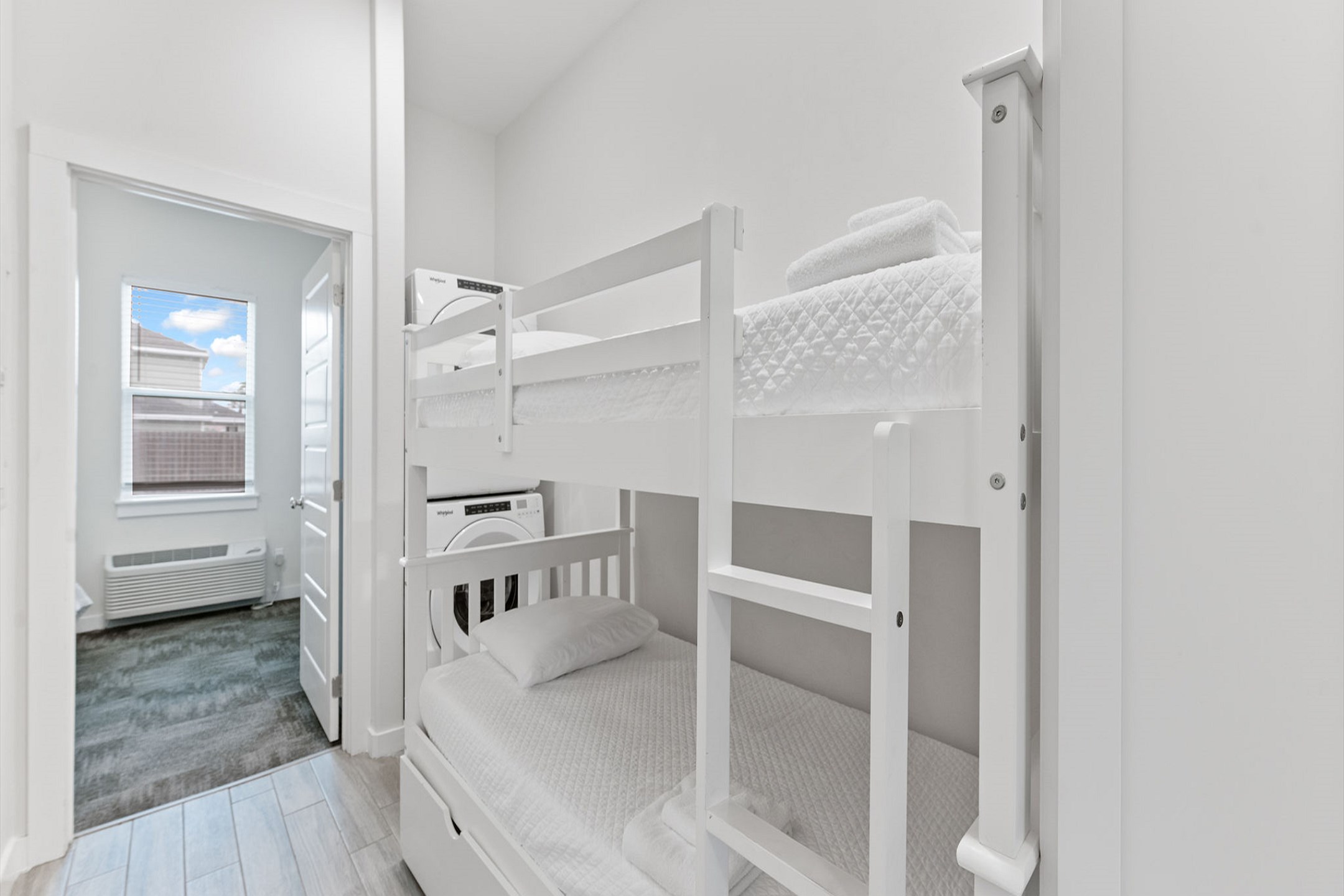 Twin over twin size bunk bed off the hallway area