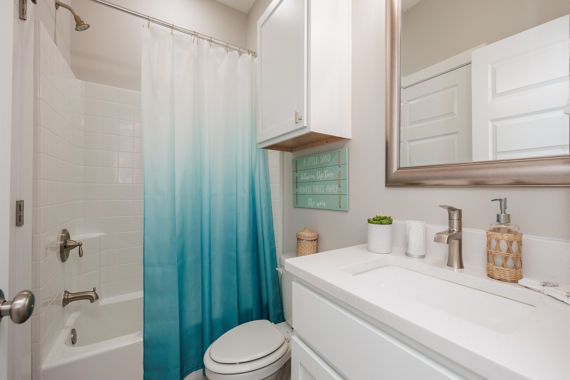Guest bathroom on the second floor with single sink, toilet and tub/shower combo