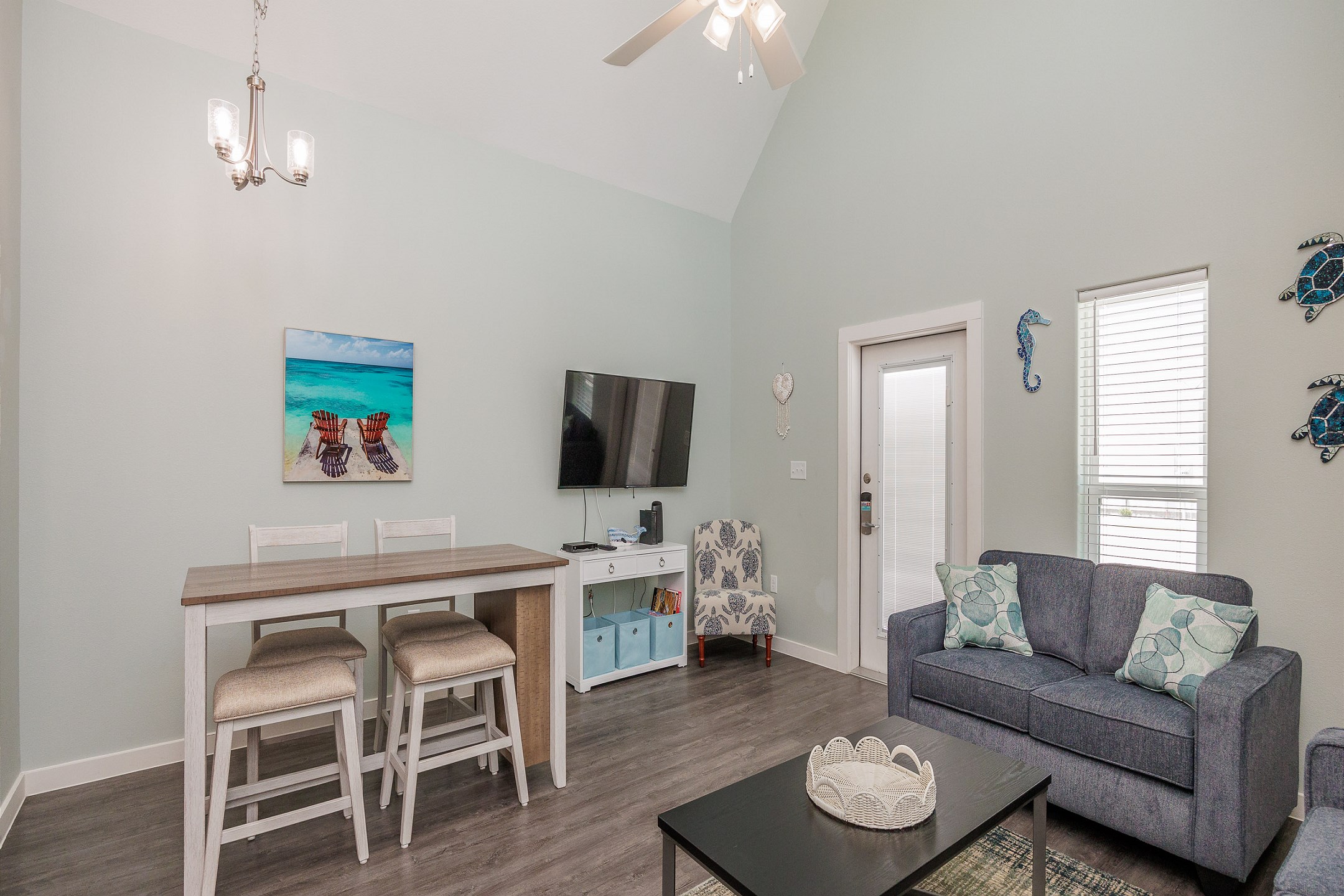 Updated living and dining space with new loveseat, dining table and decor features 