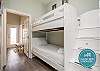 Twin over twin size bunk bed in hallway nook