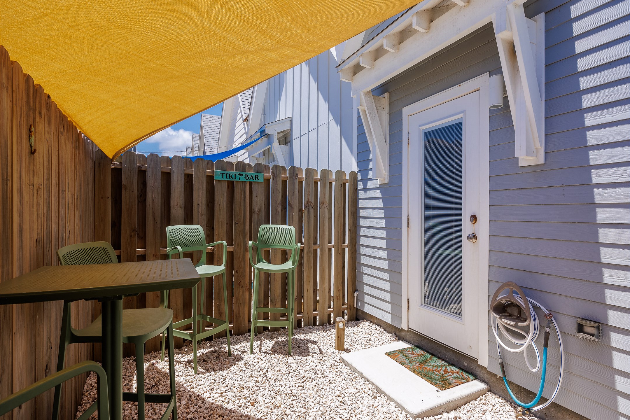 Private patio space—perfect to unwind with your favorite beverage after a walk from the beach