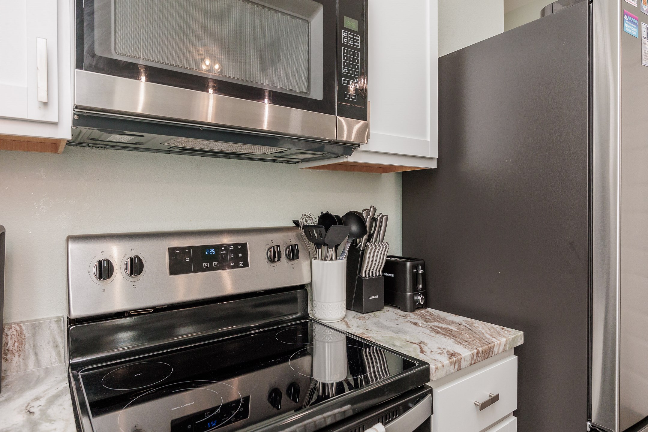 Fully equipped kitchen with stainless steel appliances
