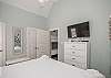 Master bedroom with king size bed, new bedframe, flat screen TV and access to private patio 