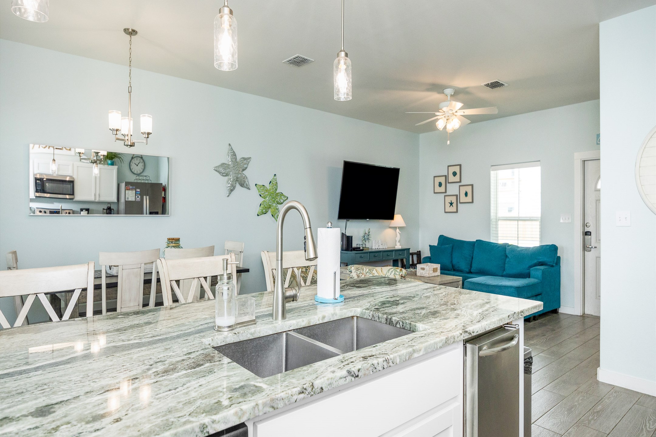 Chic kitchen featuring granite countertops and an expansive layout ideal for cooking and dining