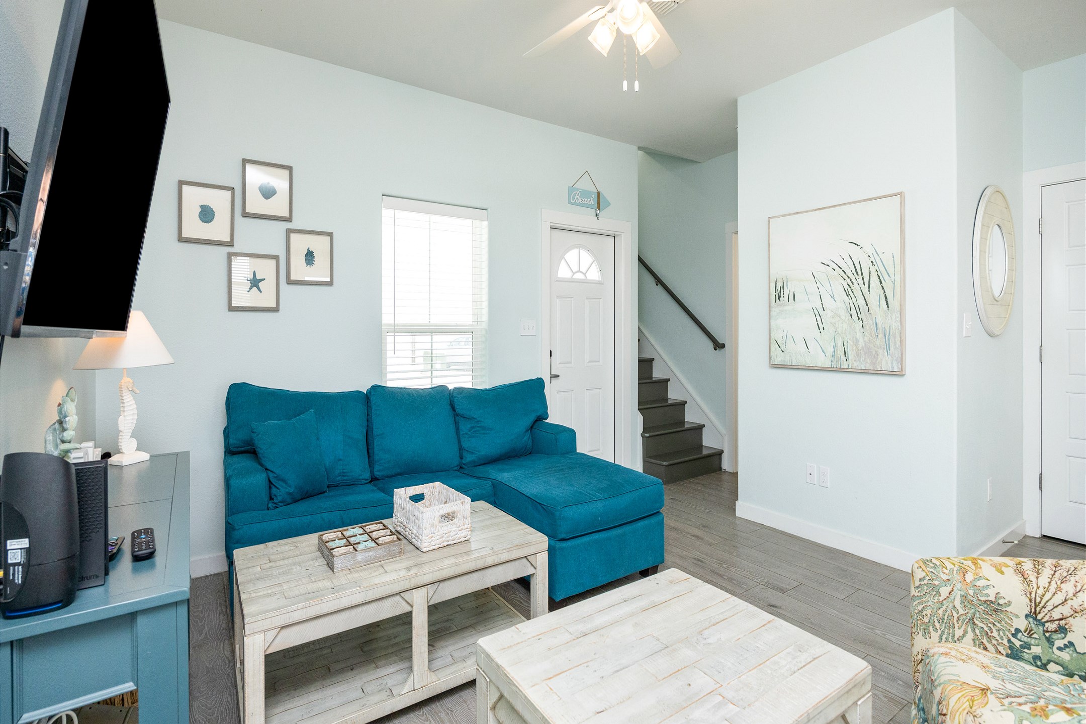 Living area with queen size sofa sleeper and flat screen TV 